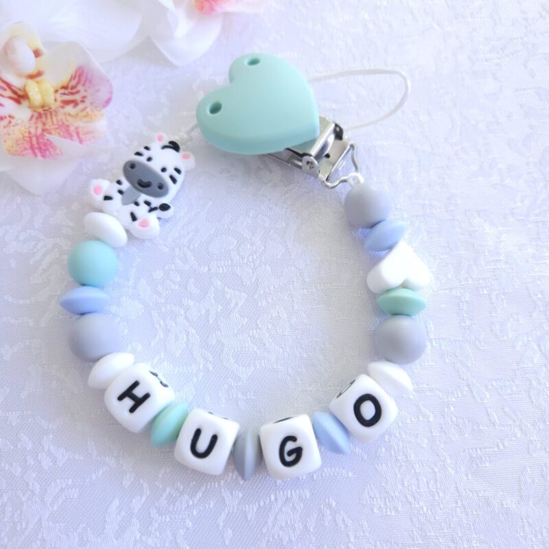 Nimeline lutikett Sebra – valmistatud BPA-vabast silikoonist ja kaunistatud sebrakujundusega.