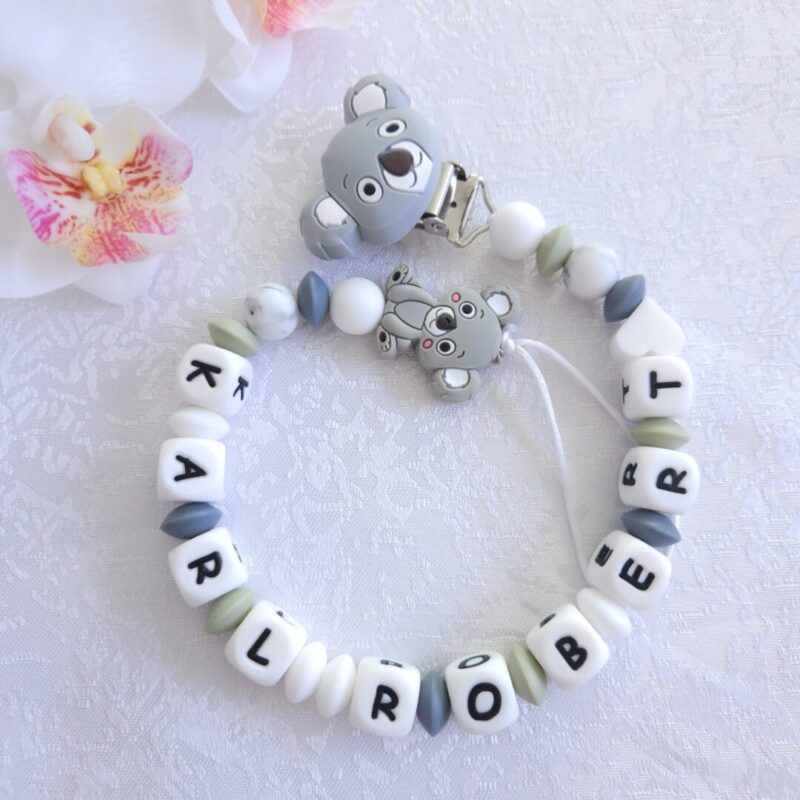 Nimeline lutikett Koaala – hall ja valge käsitöö lutikett beebile, valmistatud BPA-vabast silikoonist ja armsa koaalafiguuriga