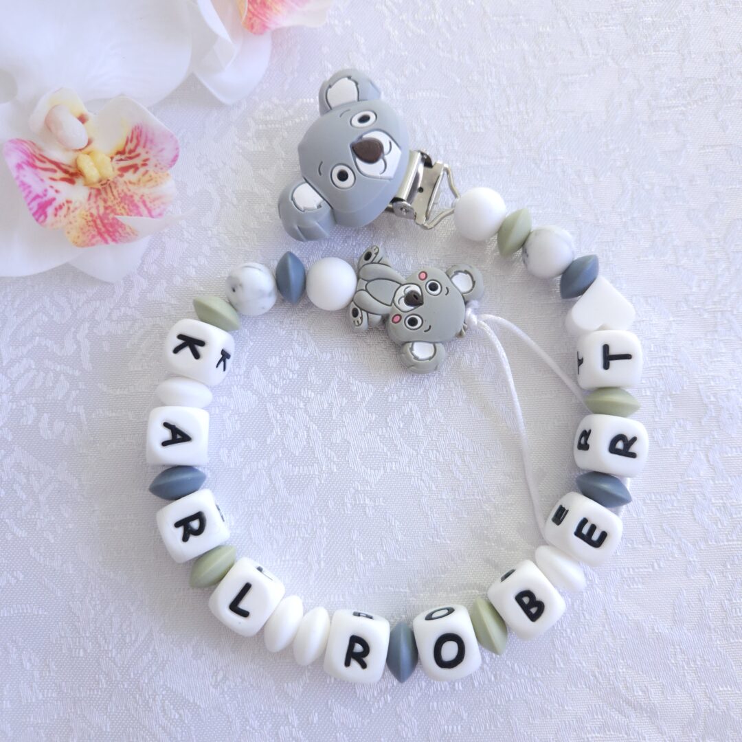 Nimeline lutikett Koaala – hall ja valge käsitöö lutikett beebile, valmistatud BPA-vabast silikoonist ja armsa koaalafiguuriga